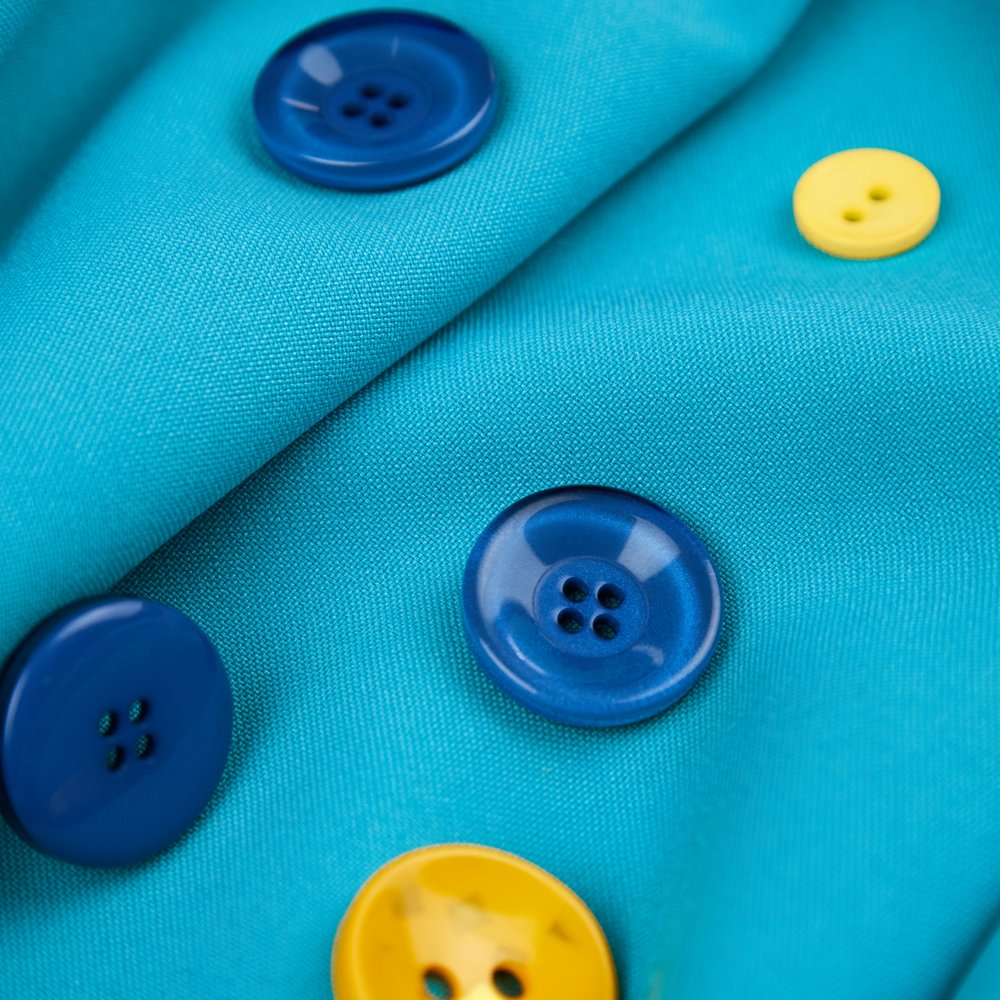 Buttons on blue fabric
